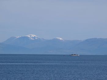 Scenic view of mountains against clear blue sky