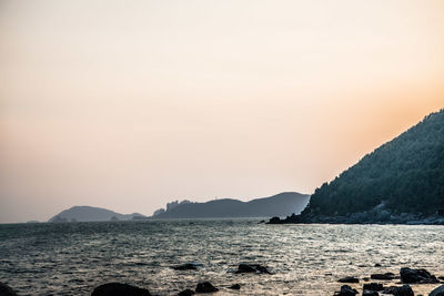 Scenic view of sea against sky during sunset