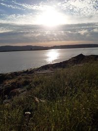 Scenic view of sea against sky during sunset