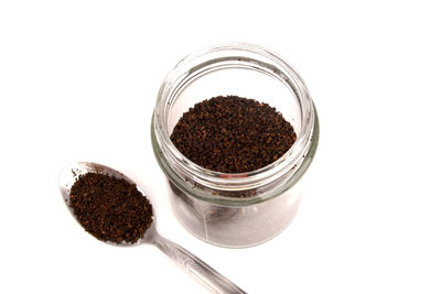 High angle view of coffee beans on white background