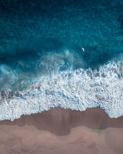 High angle view of rock formation in sea