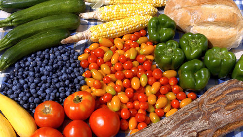 Tomatoes and vegetables for sale at market stall