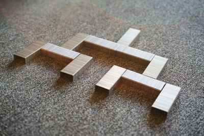 High angle view of arrow symbol on rug