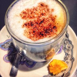 Close-up of cappuccino served on table