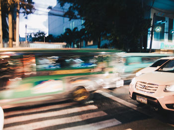 Blurred motion of car on road in city