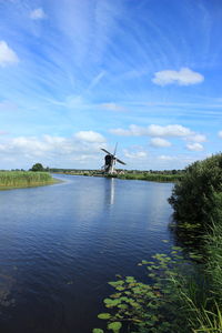 Traditional windmill against sky