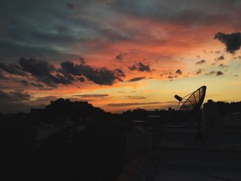 Silhouette trees against sky during sunset