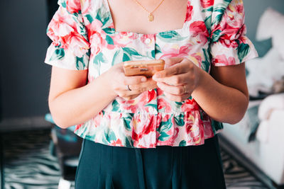 Midsection of woman holding hands