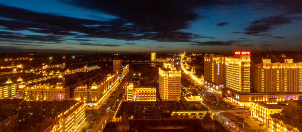 High angle view of illuminated buildings in city at night