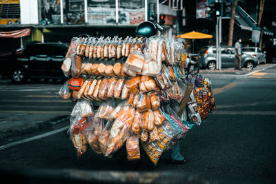 Breads for sale on motorcycle on city street