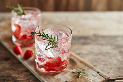 Close-up of drinks on wooden table