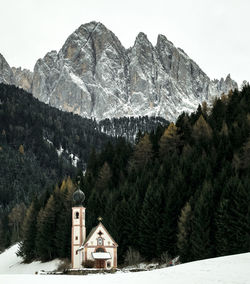 Scenic view of snowcapped mountains against clear sky,val funes.italy