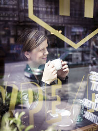 Woman having coffee in cafe