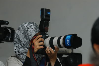 Photographer photographing through camera camera