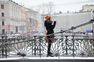 Woman standing in city