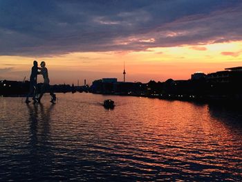 Scenic view of river at sunset