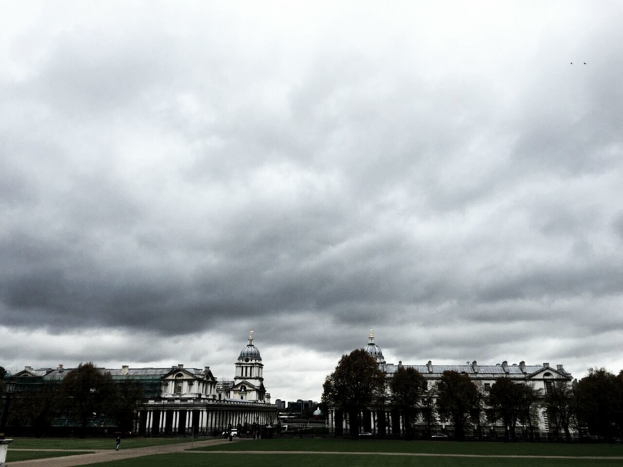 architecture, built structure, sky, building exterior, cloud - sky, cloudy, overcast, tree, grass, weather, history, cloud, day, outdoors, low angle view, travel destinations, incidental people, nature, storm cloud, no people