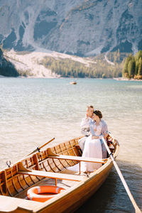 People in boat at lake