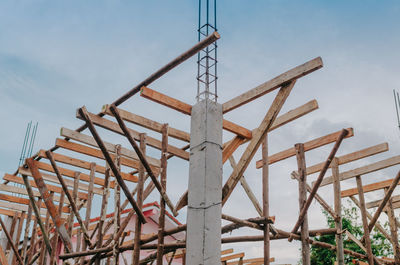 Low angle view of metallic structure against sky