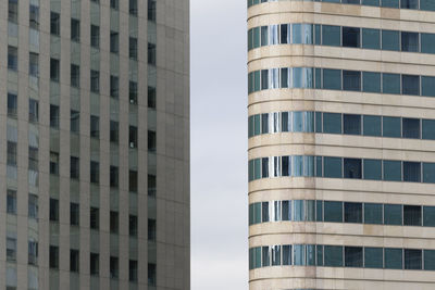 Low angle view of office building against sky