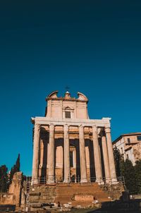 Low angle view of historical building against blue sky