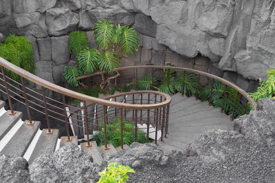 Staircase by stone wall and steps