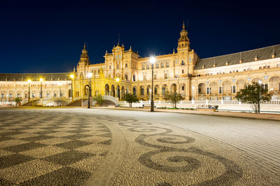 Buildings in city at night