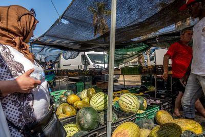 People at market stall