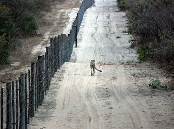 Full length of man on footpath