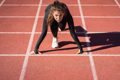 Full length of young woman running