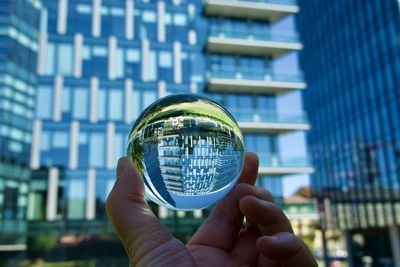 Cropped hand holding crystal ball