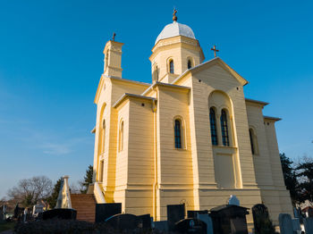 Low angle view of building against blue sky