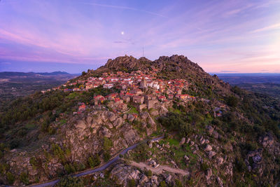 Drone aerial panorama view of monsanto historic village at sunset, in portugal