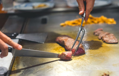 Midsection of person preparing food