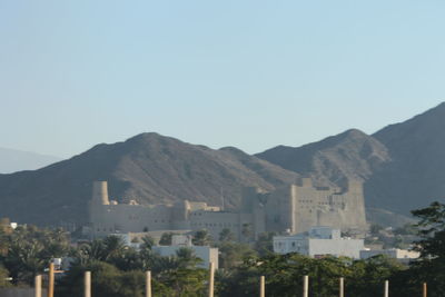 View of a town with mountain range in the background