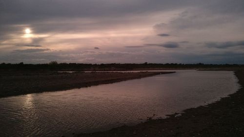 Scenic view of landscape against sky at sunset