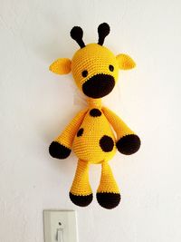 Close-up of stuffed toy against wall