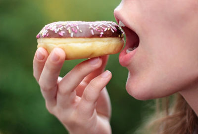 Close-up of woman eating food