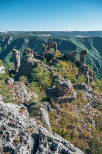 High angle view of rock formation on land against sky