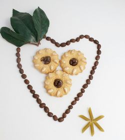 Close-up of pastry over white background