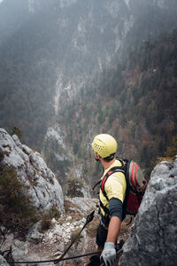 High angle view of climber looking at valley