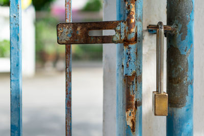 Close-up of padlock on rusty door