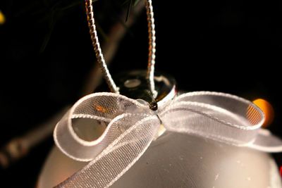 Close up of bauble hanging on christmas tree