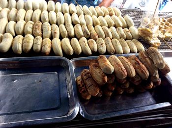 High angle view of baked food for sale in bakery