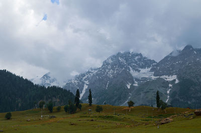 Scenic view of snowcapped mountains against sky