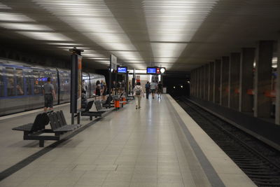 People waiting at railroad station platform