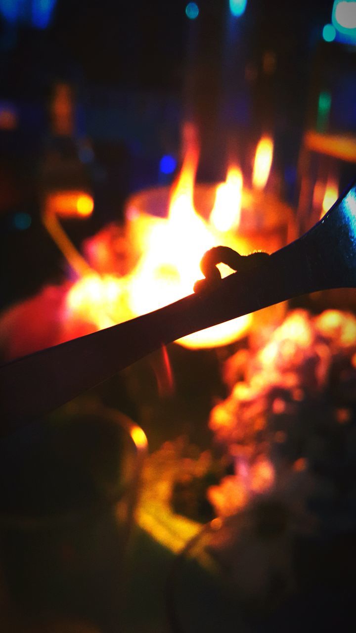 burning, flame, illuminated, glowing, fire - natural phenomenon, night, close-up, heat - temperature, light - natural phenomenon, selective focus, indoors, focus on foreground, fire, candle, dark, orange color, lit, no people, part of, lens flare