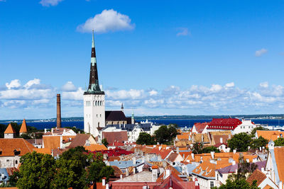 Buildings in city against sky