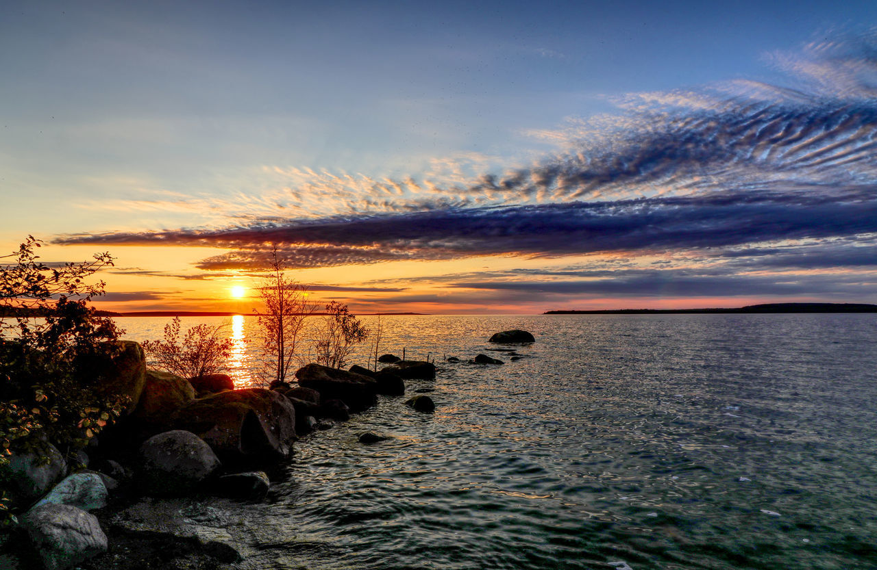SCENIC VIEW OF SEA AGAINST ORANGE SKY