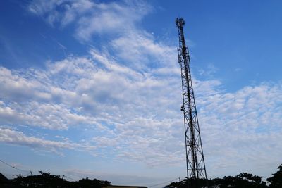 Low angle view of communications tower against sky